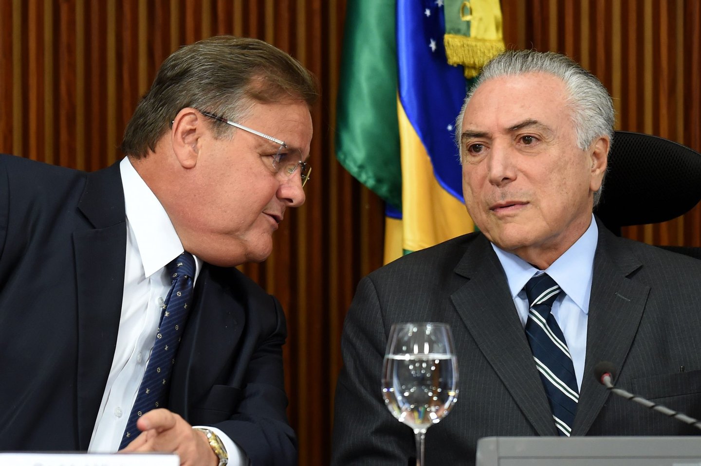 Brazilian acting President Michel Temer (R) and the General Secretary of the Brazilian Presidency Geddel Vieira Lima speak during a meeting with party leaders of the National Congress at Planalto Palace in Brasilia, on June 15, 2016. Temer is seeking support for the approval of a fiscal adjustment that he will send this week to the Congress. / AFP / EVARISTO SA (Photo credit should read EVARISTO SA/AFP/Getty Images)