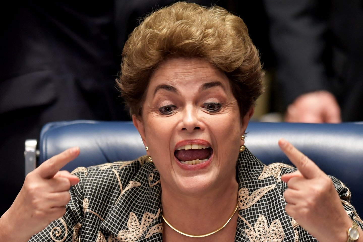 Suspended Brazilian President Dilma Rousseff gestures during her testimony in her impeachment trial at the National Congress in Brasilia on August 29, 2016. Rousseff told senators in emotional, combative testimony at her trial Monday that voting for her impeachment would amount to a "coup d'etat." / AFP / EVARISTO SA (Photo credit should read EVARISTO SA/AFP/Getty Images)