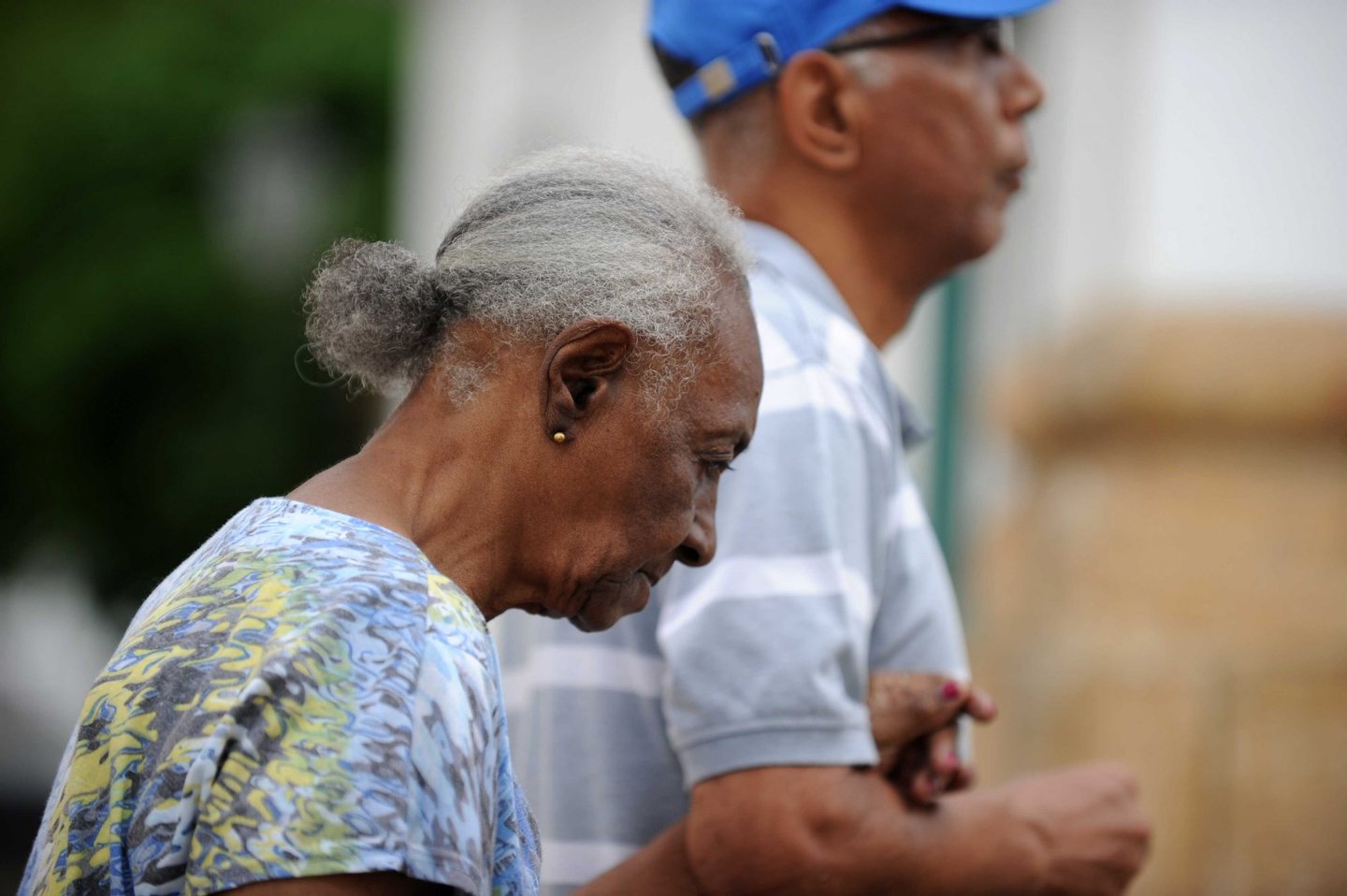An elderly couple walks along a street in Paraty, 280km south of Rio de Janeiro, Brazil on April 7, 2012. AFP PHOTO /VANDERLEI ALMEIDA (Photo credit should read VANDERLEI ALMEIDA/AFP/Getty Images)