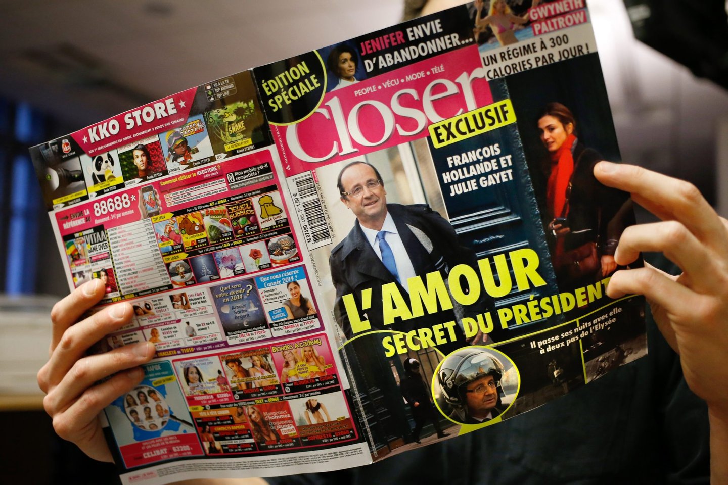 A man reads French magazine Closer, on January 10, 2014 in Paris. Closer said today President Francois Hollande was having an affair with actress Julie Gayet, backing its claim with photographs after months of swirling rumours. AFP PHOTO THOMAS COEX (Photo credit should read THOMAS COEX/AFP/Getty Images)