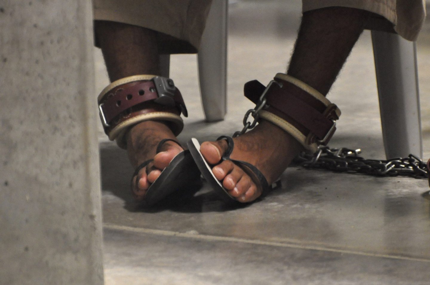 In this photo, reviewed by a US Department of Defense official, a Guantanamo detainee's feet are shackled to the floor as he attends a "Life Skills" class inside the Camp 6 high-security detention facility at Guantanamo Bay US Naval Base, Cuba, on April 27, 2009. Canadian Guantanamo detainee Omar Khadr facing a US military tribunal for alleged war crimes has reportedly turned down a plea offer that would have meant five years in prison. POOL/Michelle Shephard = IMAGE REVIEWED BY THE US DEPARTMENT OF DEFENSE = (Photo credit should read MICHELLE SHEPHARD/AFP/Getty Images)