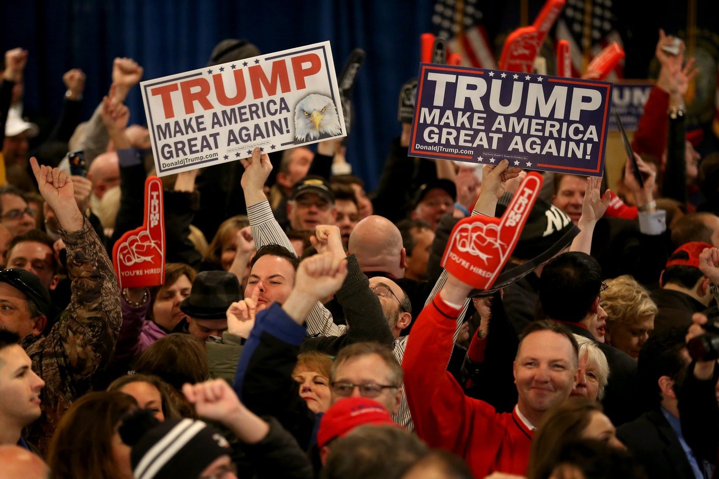 MANCHESTER, NH - FEBRUARY 09: Supporters cheer for Donald Trump during a New Hampshire Primary Night Gathering In Manchester on February 9, 2016 in Manchester, New Hampshire. Trump was projected the Republican winner shortly after the polls closed. (Photo by Joe Raedle/Getty Images)