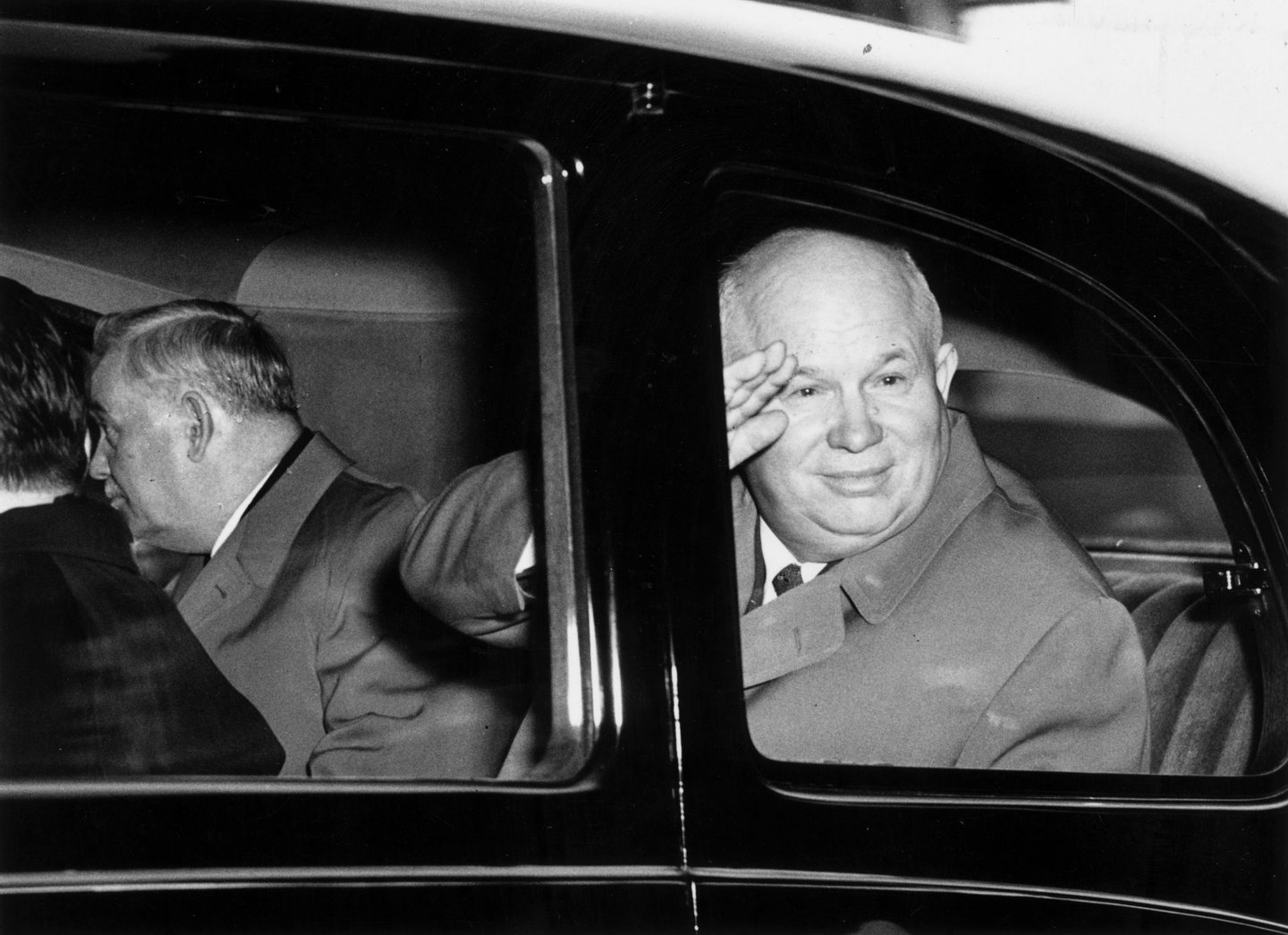 20th April 1956: First secretary of the Soviet Communist party Nikita Sergeyevich Khrushchev (1894 - 1971) greeting onlookers at the Mansion House in London. Travelling with him is Marshal Bulganin (1895 - 1975). (Photo by Fred Ramage/Keystone/Getty Images)