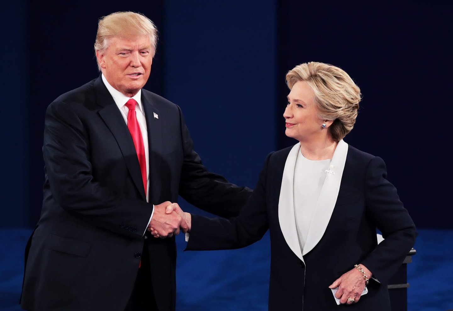 ST LOUIS, MO - OCTOBER 09: Republican presidential nominee Donald Trump (L) shakes hands with Democratic presidential nominee former Secretary of State Hillary Clinton during the town hall debate at Washington University on October 9, 2016 in St Louis, Missouri. This is the second of three presidential debates scheduled prior to the November 8th election. (Photo by Scott Olson/Getty Images)