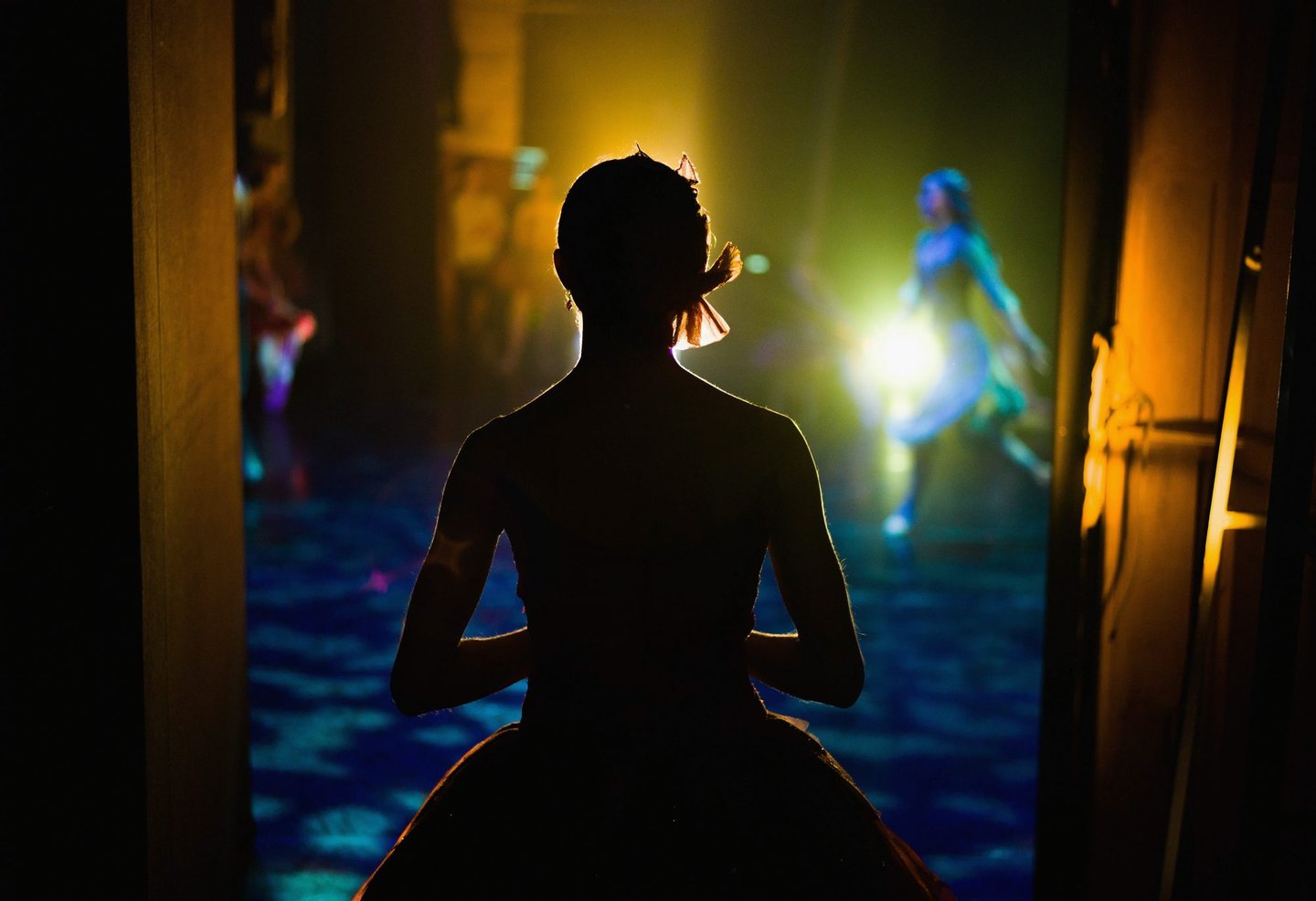 LEEDS, ENGLAND - DECEMBER 18: A ballet dancer waits in the wings for her turn to take the stage during a performance of The Nutcracker by Northern Ballet at the Grand Theatre on December 18, 2015 in Leeds, England. Northern Ballet is a dance company with a strong repertoire in theatrical dance productions where the emphasis is on story telling as well as classical ballet. Regarded as one of the world's greatest ballet companies they are committed to creating new ballets and tour widely to perform to audiences throughout the UK and abroad. (Photo by Ian Forsyth/Getty Images)