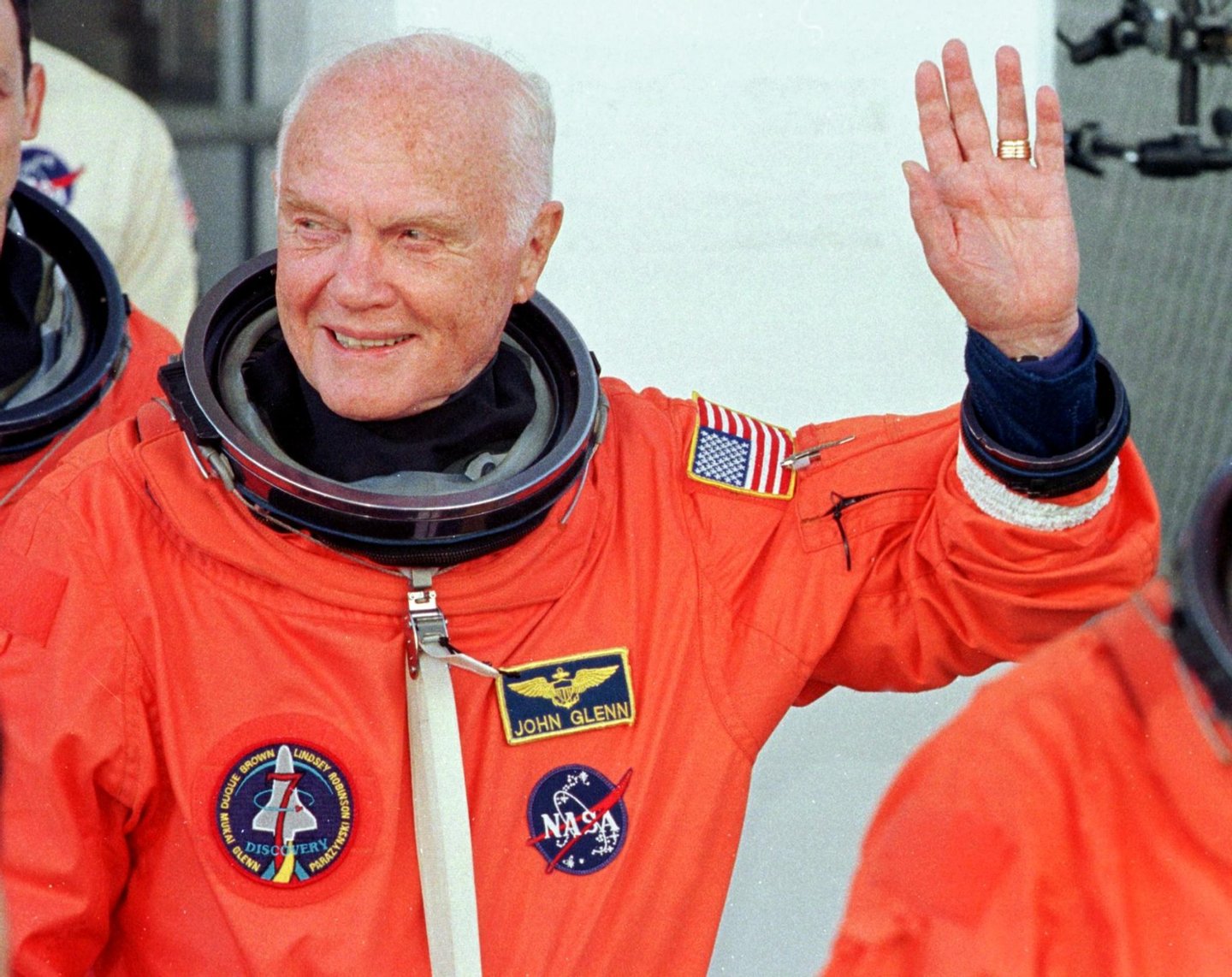 KENNEDY SPACE CENTER, UNITED STATES: US astronaut and senator John Glenn waves as he leaves the Operations and Check out building at the Kennedy Space Center, FL, 29 October in route to board the US space shuttle Discovery. The seven person crew will perform several scientific experiments during their nine day mission, including studies on the effects of weightlessness on 77-year-old Glenn. Glenn who is 77 years old will be the oldest man to fly into space. AFP PHOTO Roberto SCHMIDT (Photo credit should read ROBERTO SCHMIDT/AFP/Getty Images)