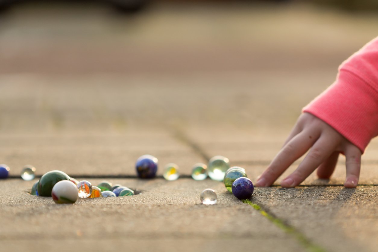 Crystal, Girls, Cement, Play, Marbles, Child, Playing, Sidewalk, Fun, Caucasian Ethnicity, One Person, Variation, Happiness, Circle, Sphere, Pink Color, Colors, Glass - Material, Shiny, Lifestyles, Childhood, Human Hand, People, Sunlight, Land, Street, Toy, Leisure Games, 