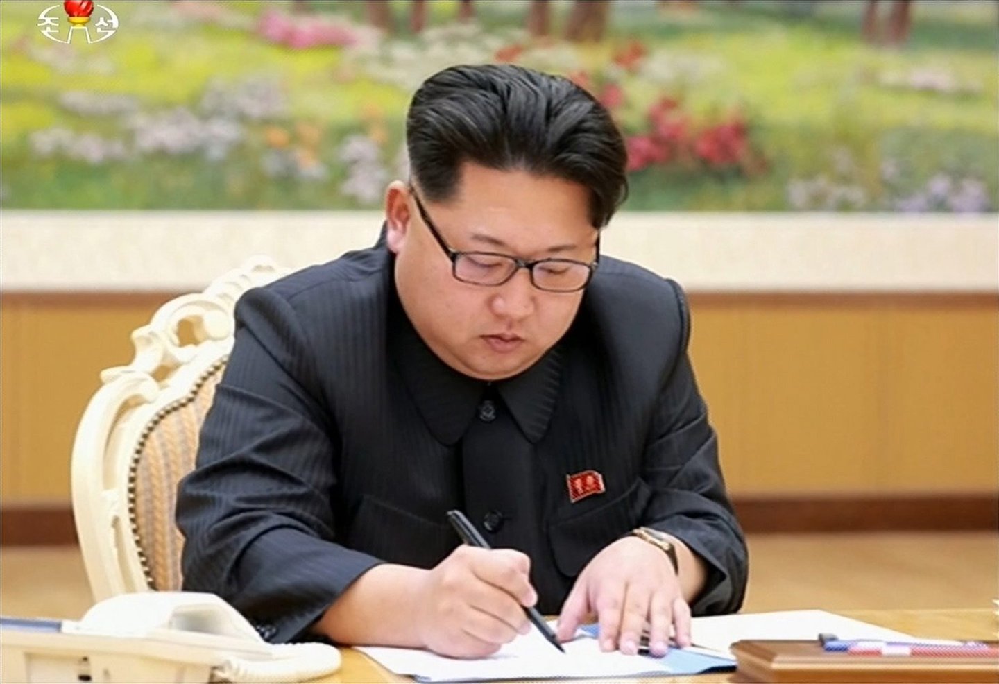 North Korea's top leader Kim Jong-un signs an order for the country to conduct a hydrogen bomb test