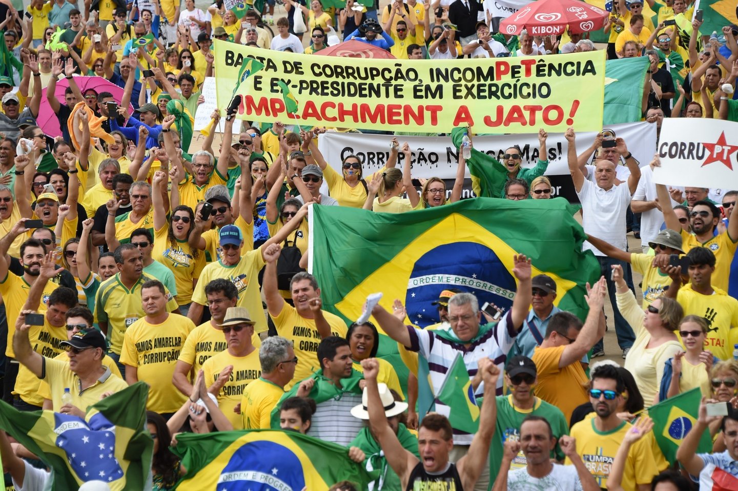 Demostrators protest against the government of Brazilian President Dilma Rousseff in Brasilia, on March 15, 2015. Tens of thousands of Brazilians turned out for demonstrations Sundays to oppose leftist president Dilma Rousseff, a target of rising discontent amid a faltering economy and a massive corruption scandal at state oil giant Petrobras. AFP PHOTO/EVARISTO SA (Photo credit should read EVARISTO SA/AFP/Getty Images)