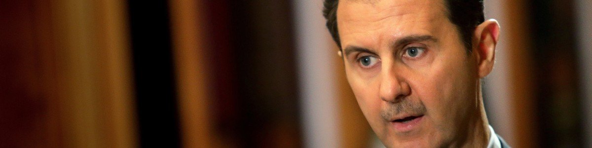 In a picture released on January 20, 2014, Syrian President Bashar al-Assad speaks during an interview with AFP at the presidential palace in Damascus on the weekend. The Syrian president told AFP in an exclusive interview, days before the beginning of the Geneva II peace talks, that he expected his country's bloody conflict to drag on, describing it as a "fight against terrorism" and rejecting any distinction between opposition fighters and radical jihadists. AFP PHOTO/JOSEPH EID -- EDITORS NOTE: The Syrian presidency media office reviewed this series of pictures (Photo credit should read JOSEPH EID/AFP/Getty Images)
