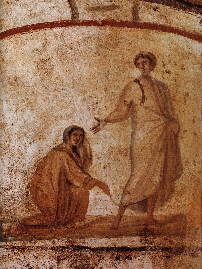 Um dos primeiros exemplos conhecidos de arte cristã Jesus cura uma mulher. Roma, Catacumbas de Marcelino e Pedro, século IV