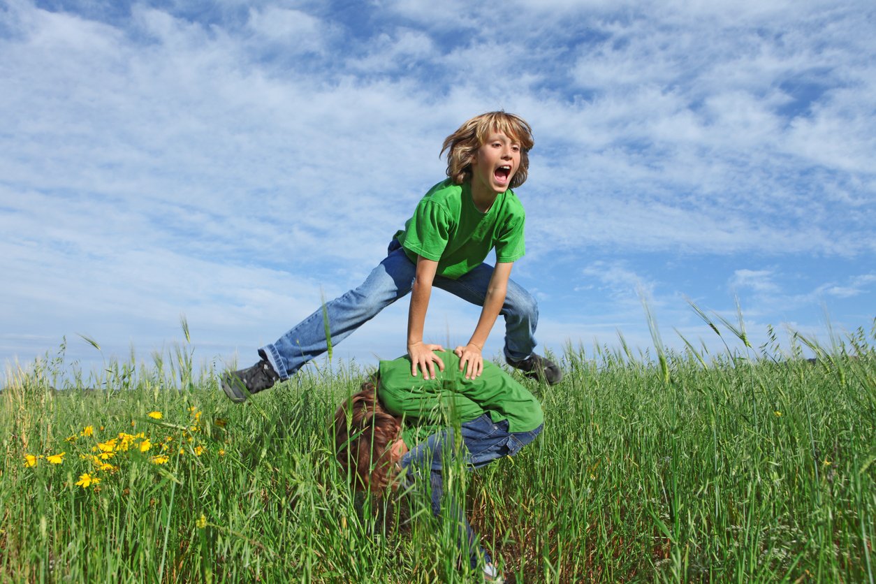 Action, Bouncing, Child, Children Only, Exercising, Field, Friendship, Fun, Grass, Healthy Lifestyle, Jeans, Joy, Jumping, Leapfrog, Little Boys, Meadow, Outdoors, Pasture, Playful, Playing, Sport, Spring, Summer, T-Shirt, Twin, springing,