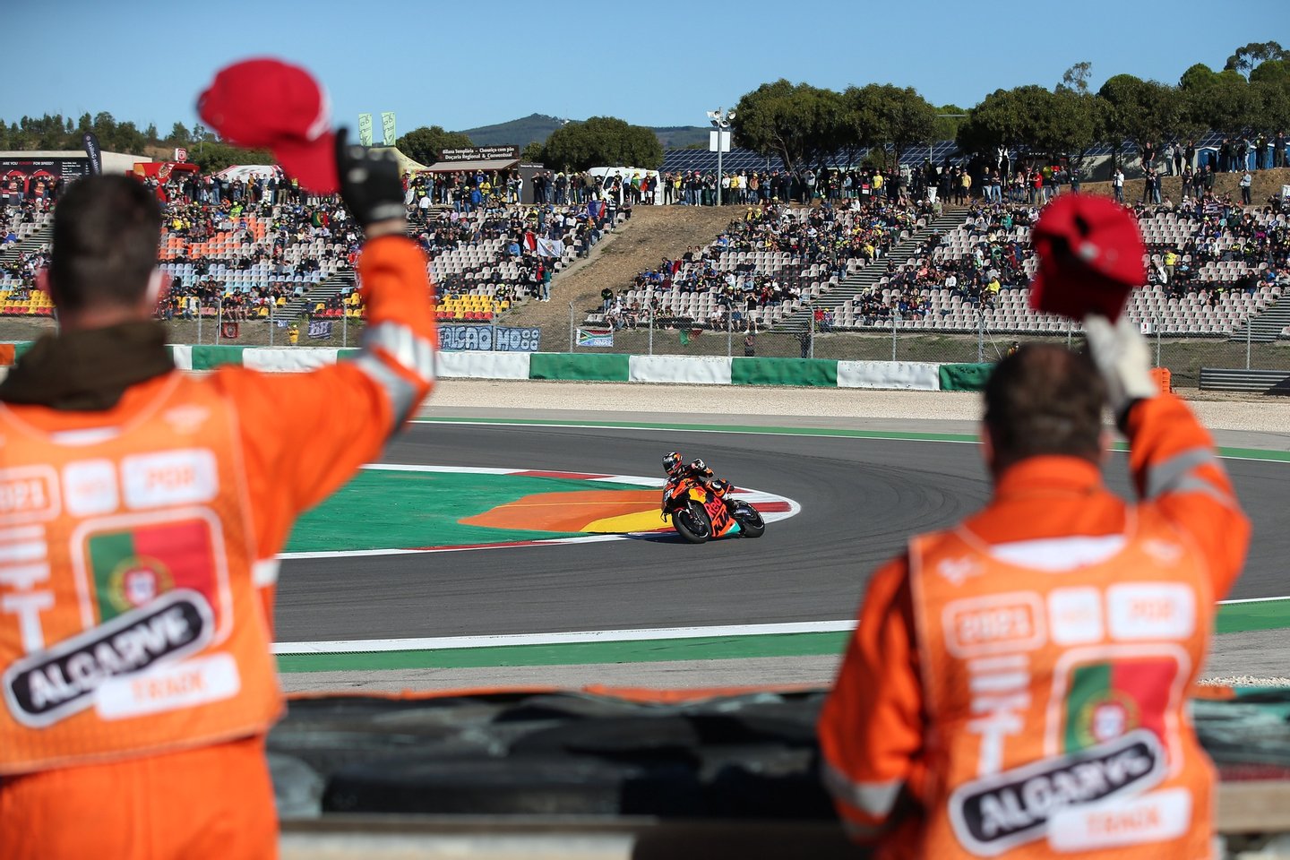 Staff workers waves to Portuguese MotoGP rider Miguel Oliveira of Red Bull KTM Factory Racing team, during the warm up for the Algarve Motorcycling Grand Prix at the Algarve International race track in Portimão, Southern Portugal, 07 November 2021. NUNO VEIGA/LUSA